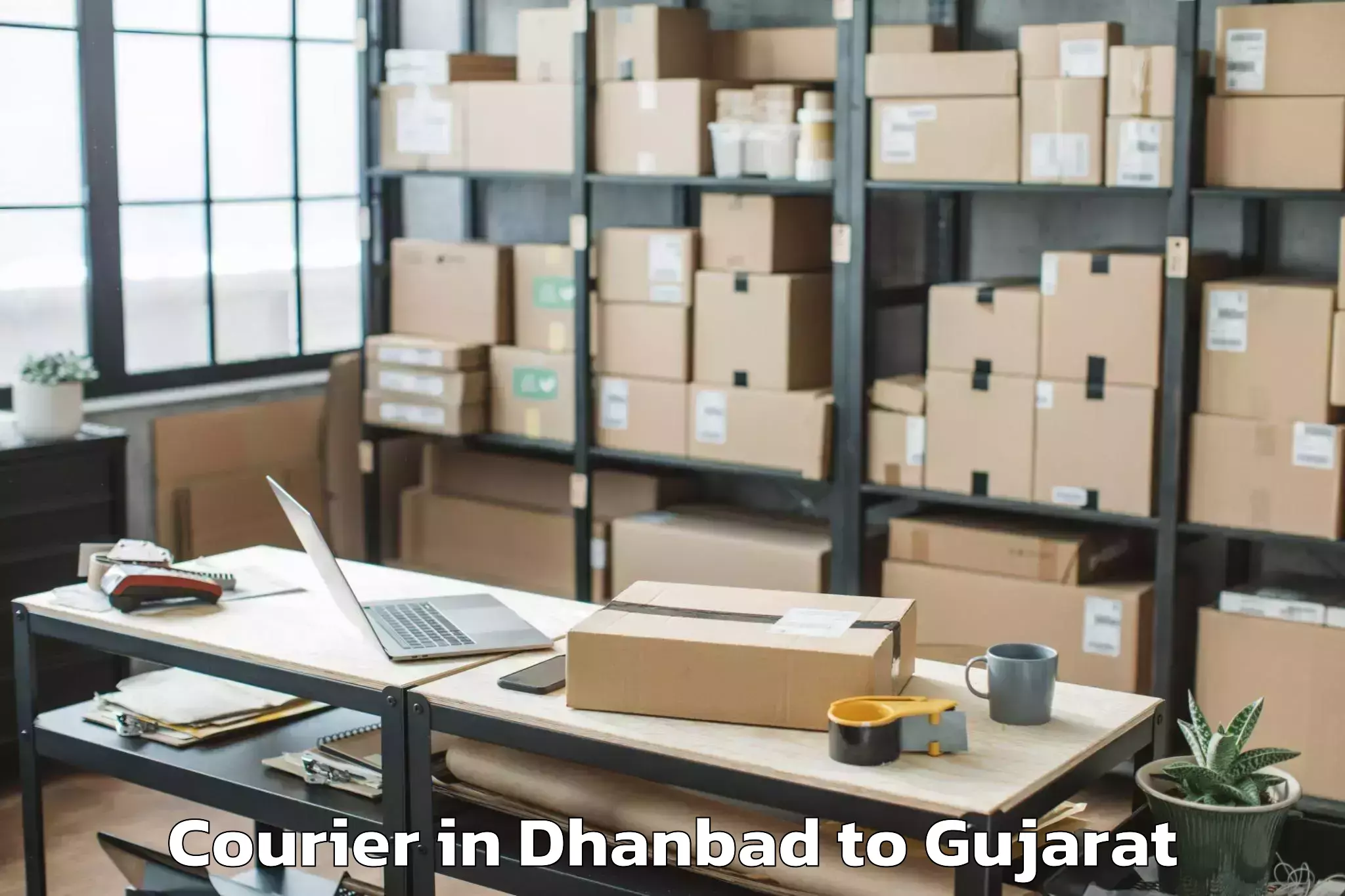 Book Your Dhanbad to Gujarat National Law Universit Courier Today